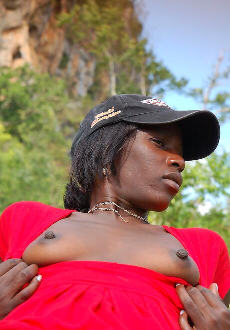 Gracile hottie Maria L uncovering small tits and sexy ass outside