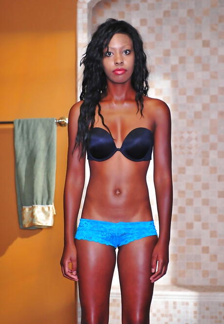 Attractive american brunette Melissa Monet denudes big tits and spreads her legs 